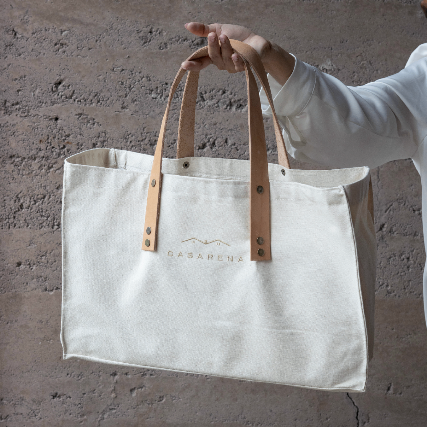 Bolso Casarena de lona con manijas de cuero